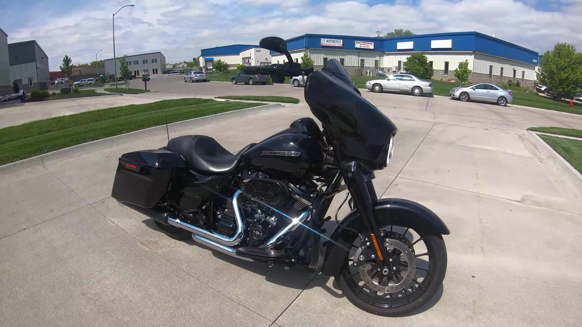 Chrome TAB Performance 2-into-2 Fully Shielded header installed on a black Milwaukee-Eight Harley-Davidson Street Glide, front three-quarter view