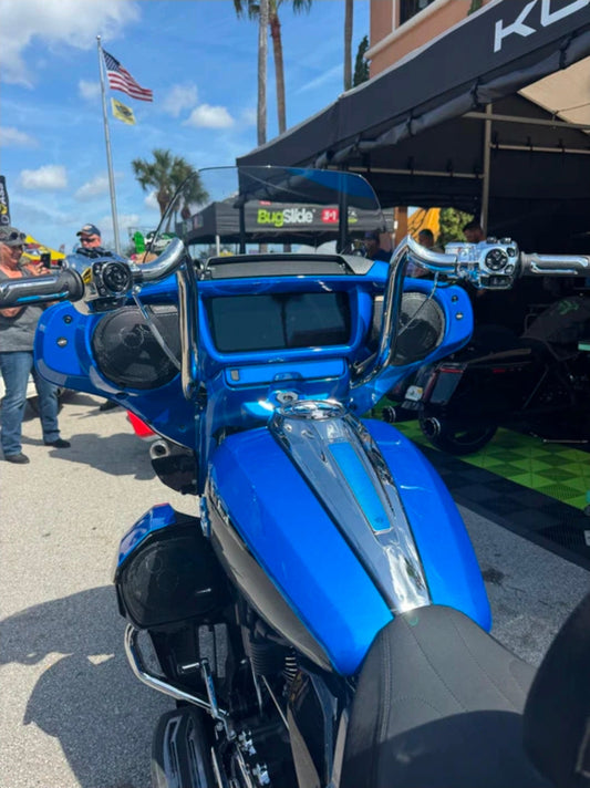 Chrome KST Bison Bagger meathook handlebars installed on a blue 2024-2026 Harley Street Glide