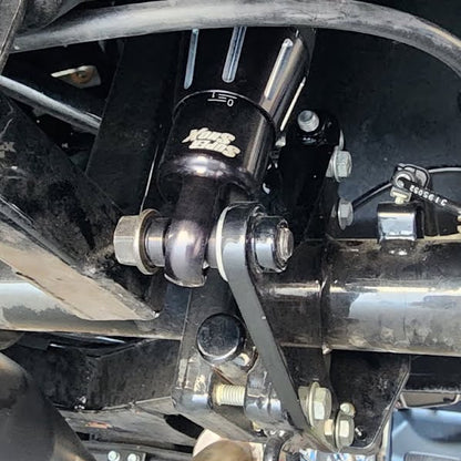 Close-up of a motorcycle suspension system with visible branding.