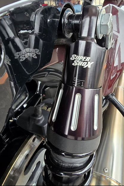Super Shox rear shock with adjustable preload installed on a Harley touring bike