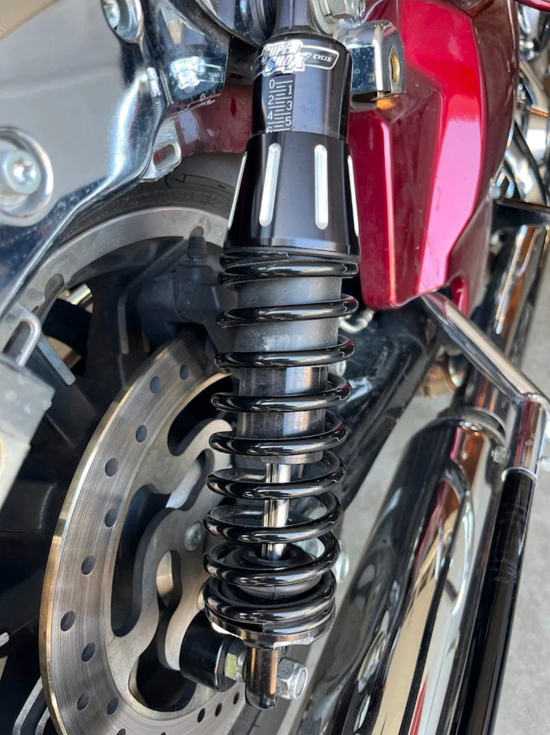 Super Shox rear shock installed on a red Harley-Davidson touring motorcycle
