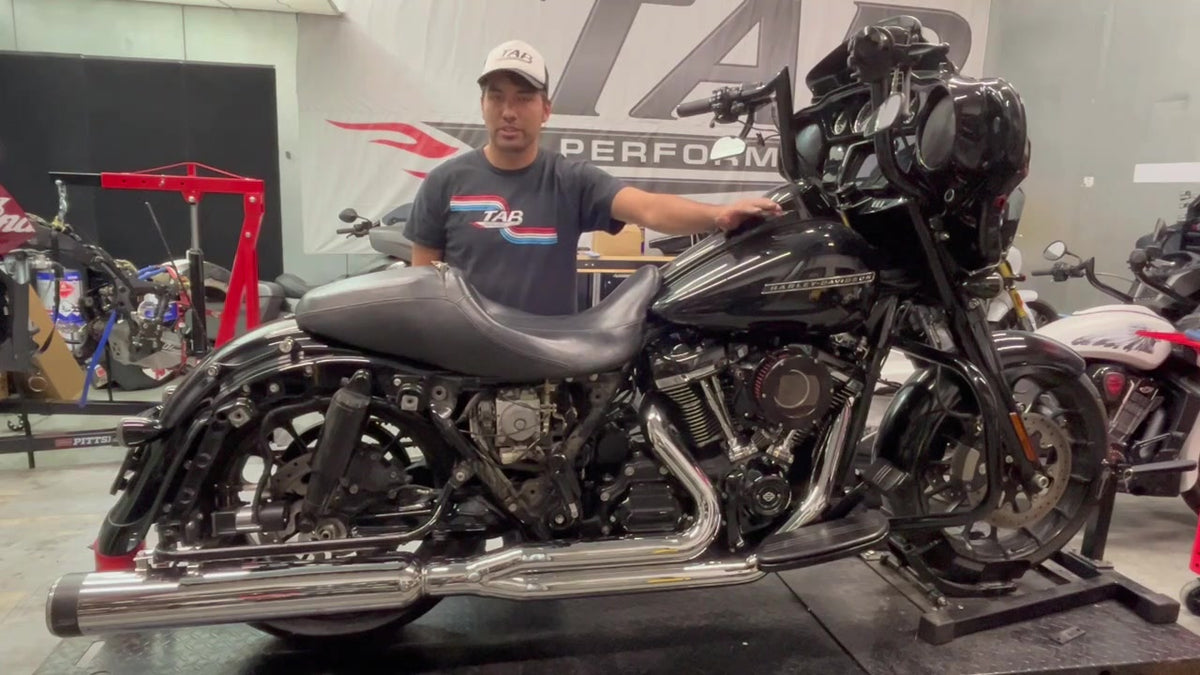 TAB Performance Redline 2-1 full exhaust system in chrome installed on a black 2019 Harley-Davidson Street Glide, right side view in the TAB shop