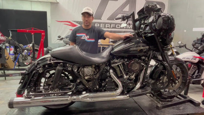 TAB Performance Redline 2-1 full exhaust system in chrome installed on a black 2019 Harley-Davidson Street Glide, right side view in the TAB shop